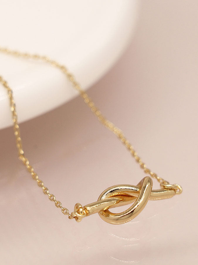 Faux Gold Plated Dainty Knot Necklace – stylish accessories from C&K, an independent lifestyle store in Settle, North Yorkshire.