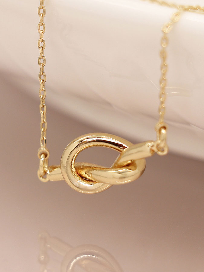 Faux Gold Plated Dainty Knot Necklace – stylish accessories from C&K, an independent lifestyle store in Settle, North Yorkshire.