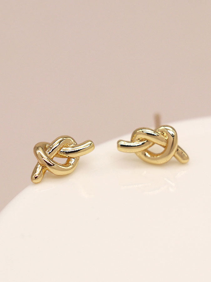 Faux Gold Plated Tiny Knot Stud Earrings – stylish accessories from C&K, an independent lifestyle store in Settle, North Yorkshire.