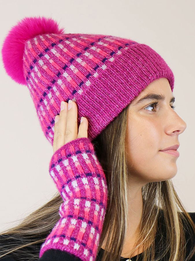 Purple/Fuchsia Firework Pom Pom Hat – stylish accessories from C&K, an independent lifestyle store in Settle, North Yorkshire.