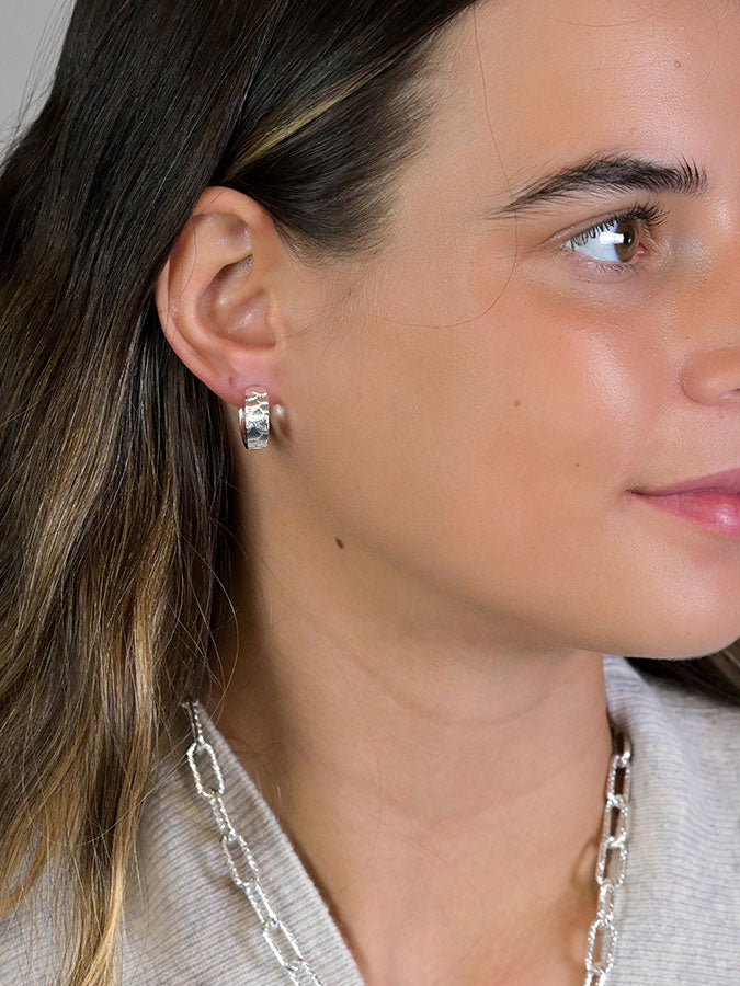 Silver Plated Scallop Embossed Huggie Hoops – stylish accessories from C&K, an independent lifestyle store in Settle, North Yorkshire.