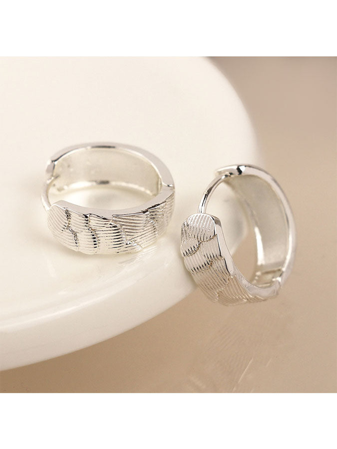 Silver Plated Scallop Embossed Huggie Hoops – stylish accessories from C&K, an independent lifestyle store in Settle, North Yorkshire.