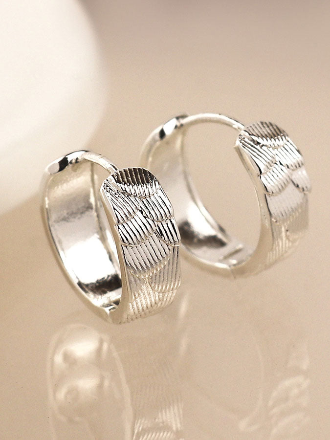 Silver Plated Scallop Embossed Huggie Hoops – stylish accessories from C&K, an independent lifestyle store in Settle, North Yorkshire.