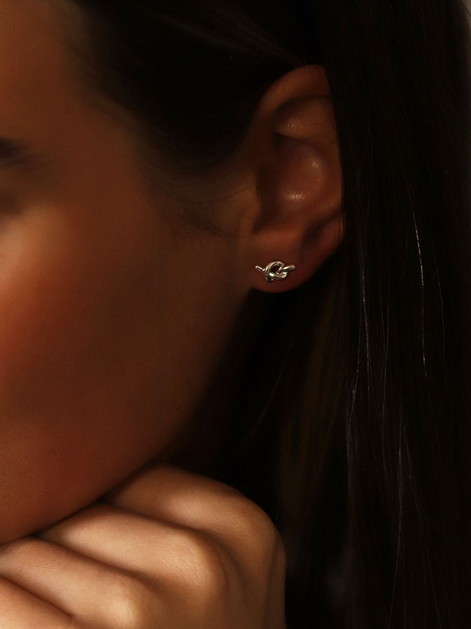 Silver Plated Tiny Knot Studs – stylish accessories from C&K, an independent lifestyle store in Settle, North Yorkshire.