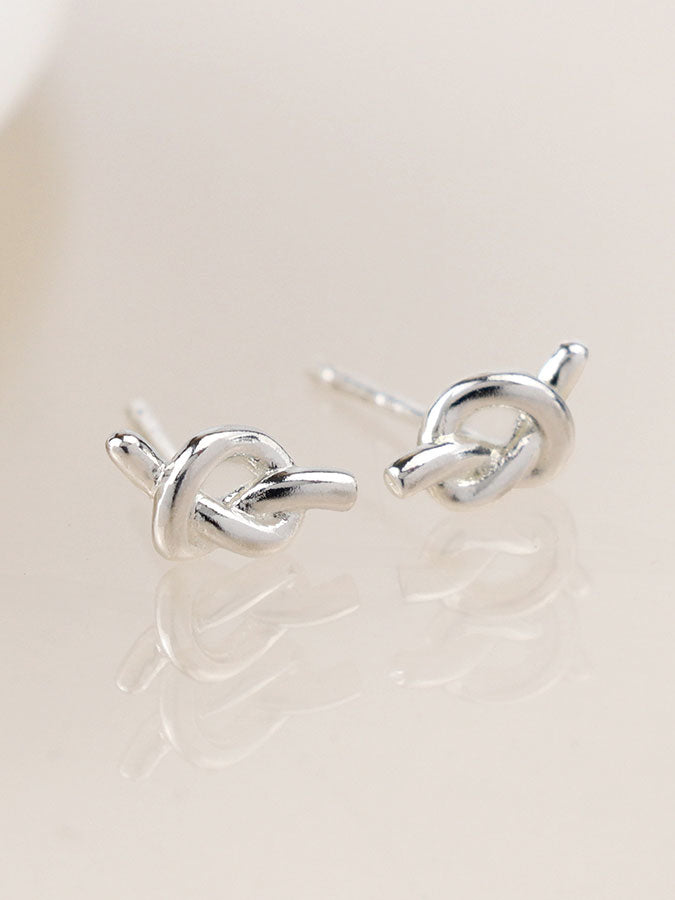 Silver Plated Tiny Knot Studs – stylish accessories from C&K, an independent lifestyle store in Settle, North Yorkshire.